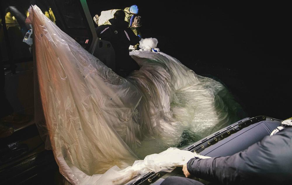 Sailors recover a high-altitude surveillance balloon on Feb. 5 off the coast of Myrtle Beach, S.C.