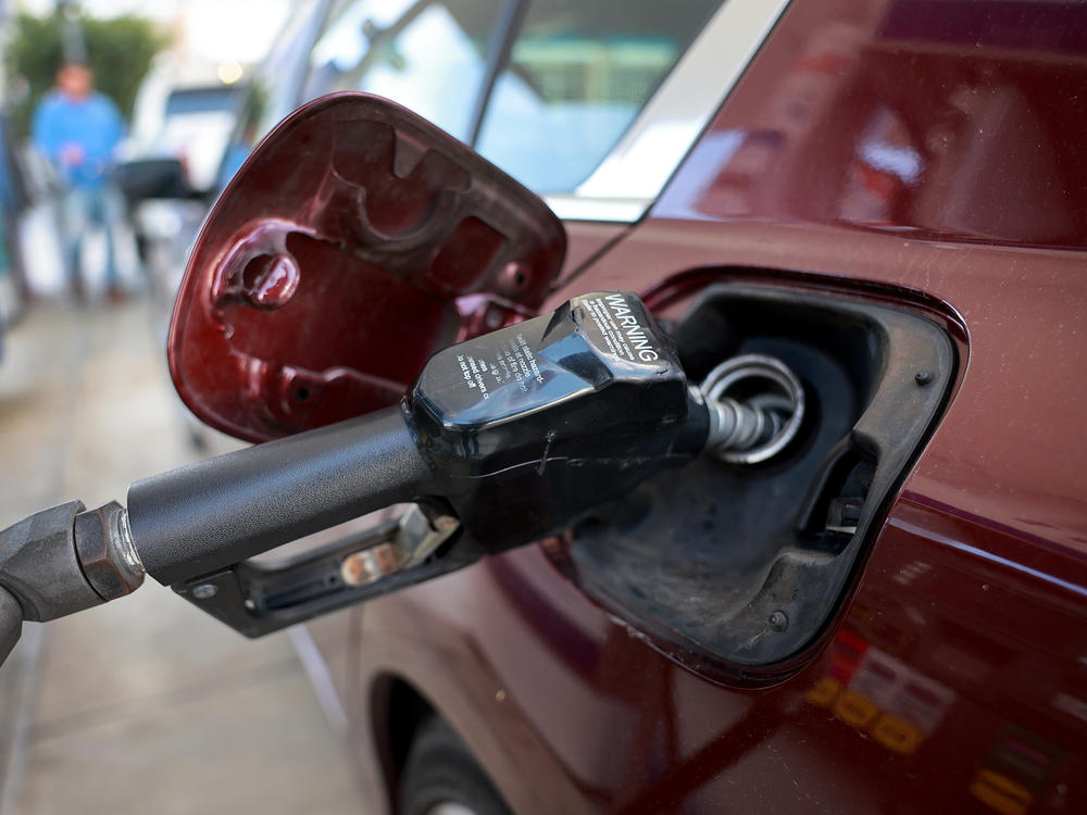 Gas is pumped into a vehicle at a gas station in Miami on Jan. 23, 2023. A rise in gas prices caused inflation to increase in January when compared to December. Gas prices remain volatile, making the outlook for inflation more uncertain.