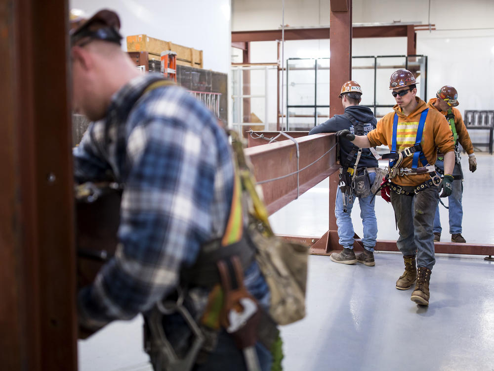 In 2018, Garret Morgan (center) was training as an ironworker near Seattle. Five years later, he says he made the right career choice: 