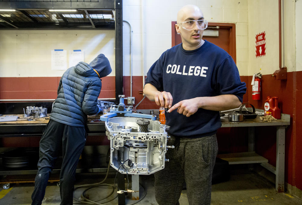 Matthew Dickinson, 21, asks a classmate for help as they rebuild an automatic transmission back in 2018 in a class at the Lake Washington Institute of Technology.