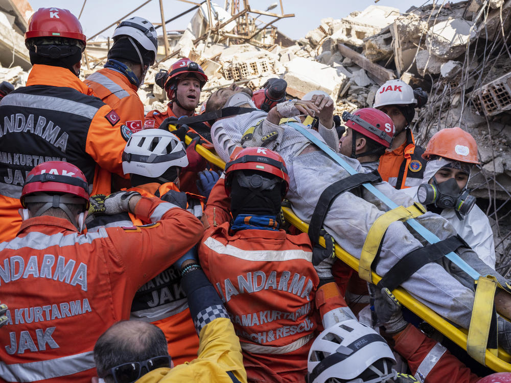 Huseyin Seferoglu, 23, is pulled from the rubble of a collapsed building in Antakya, Turkey, on Sunday.