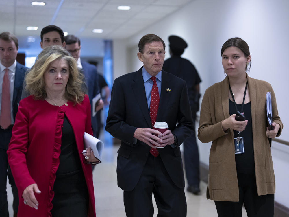 Sen. Marsha Blackburn, R-Tenn., left, and Sen. Richard Blumenthal, D-Conn., head to a secure area as lawmakers and intelligence advisers arrive for a closed briefing on the unknown aerial objects the U.S. military shot down this weekend at the Capitol on Tuesday morning.