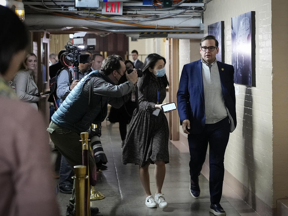 Rep. George Santos walks through the hallways after a caucus meeting at the U.S. Capitol on Jan. 10.
