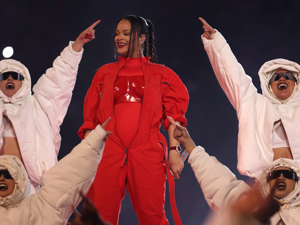 Rihanna performs onstage during the Super Bowl halftime show on Sunday night. Her performance doubled as a pregnancy reveal.