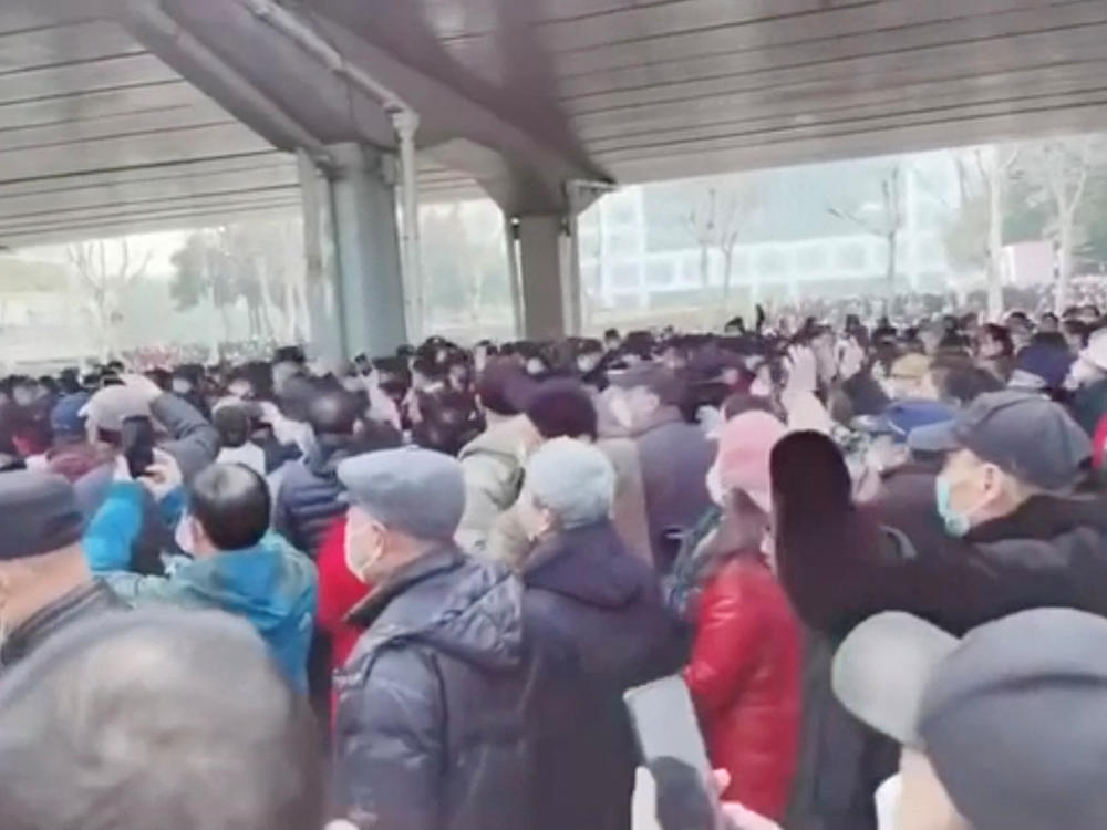 Demonstrators gather outside Zhongshan Park in Wuhan, China, to protest changes to medical benefits, on Wednesday, in this still image from social media video obtained by Reuters.