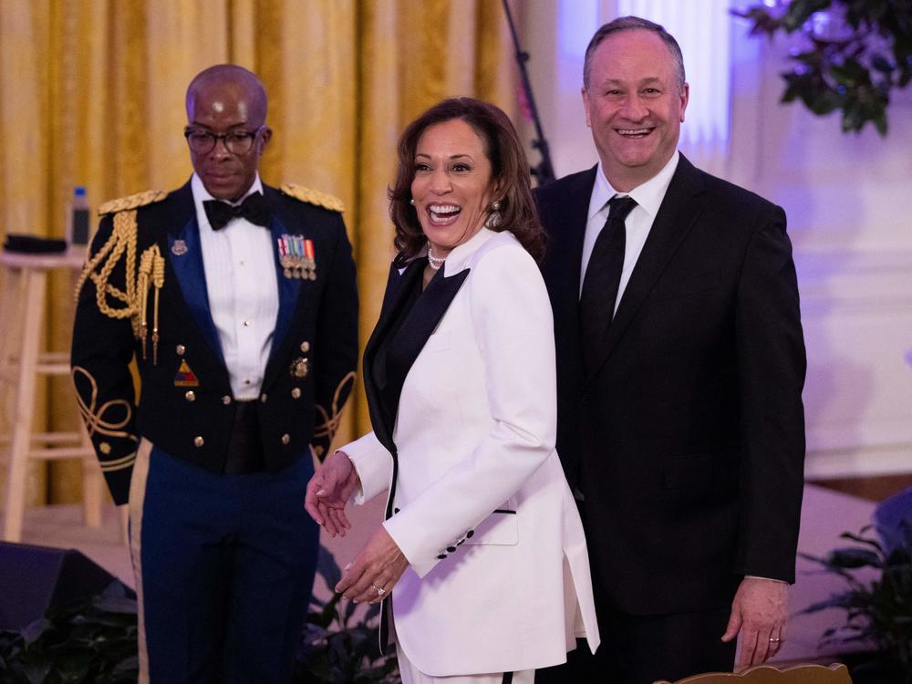 Vice President Kamala Harris (C) and second gentleman Doug Emhoff attend a dinner for governors and their spouses at the White House earlier this month.