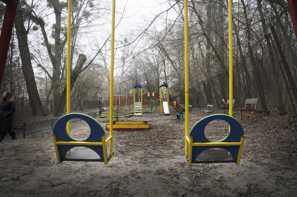 Empty swings hang over a playground in Kyiv. More than 8 million people have left the country, meaning the number of potential parents is historically low.