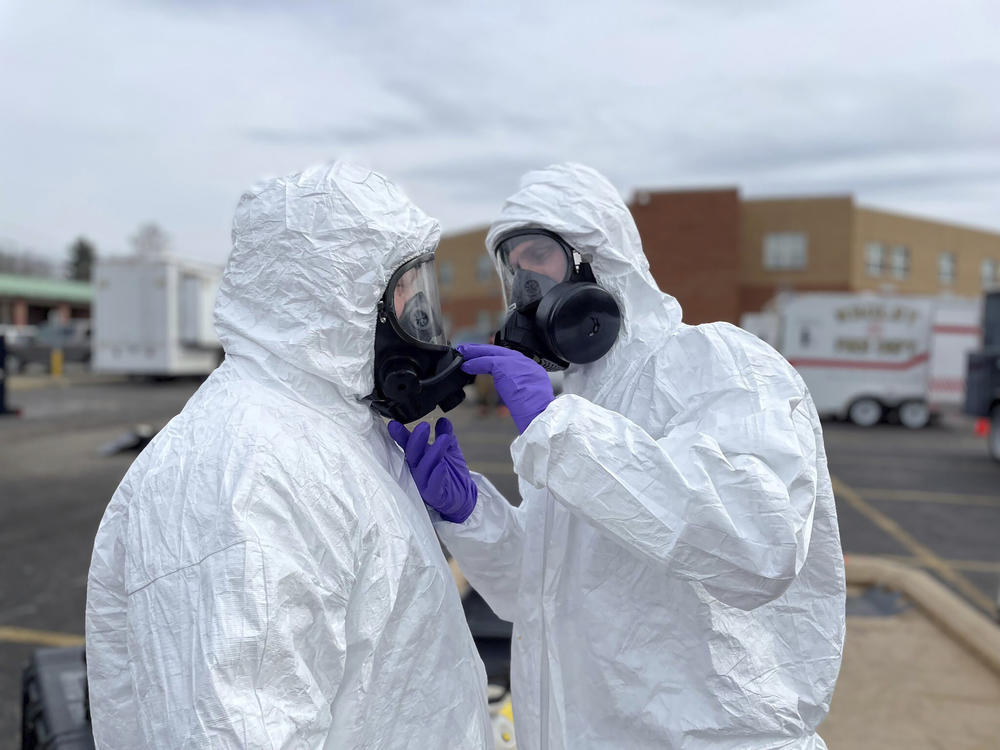 In this photo provided by the Ohio National Guard, ONG 52nd Civil Support Team members prepare to enter an incident area to assess remaining hazards in East Palestine, Ohio, on Feb. 7.