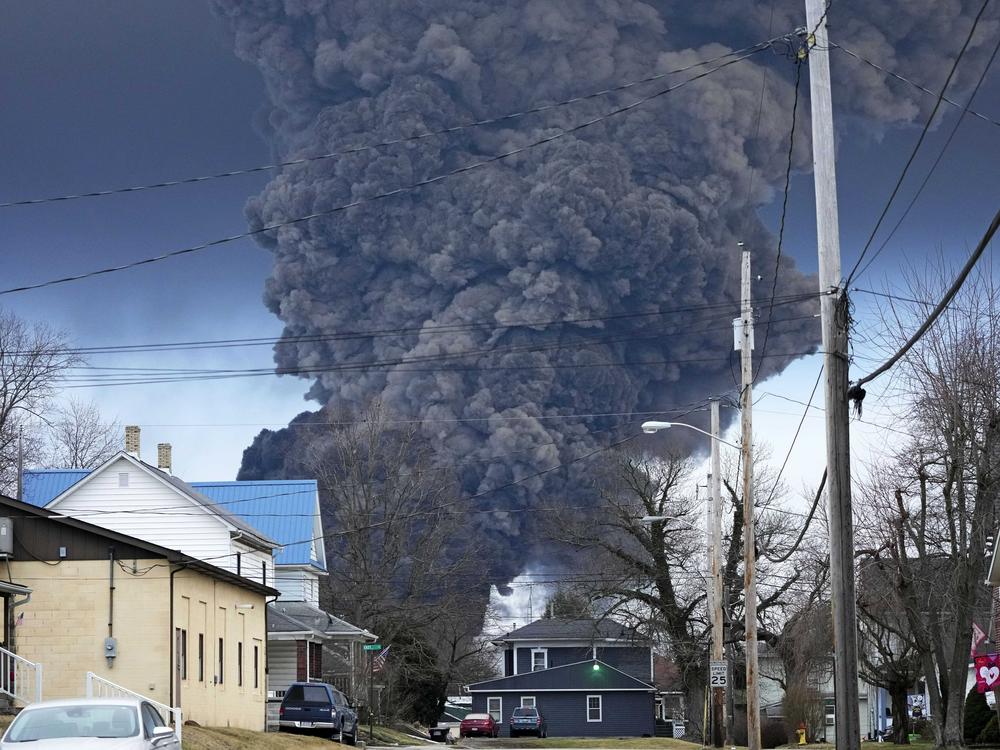 A black plume rises over East Palestine, Ohio, as a result of a controlled detonation of a portion of the derailed Norfolk Southern train on Feb. 6.