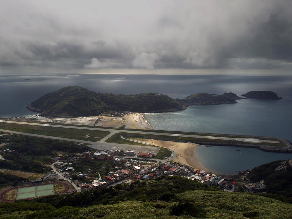 A view from the 220-meter (670 feet) summit of Mt. Bi looks down on the airport's single runway jutting out into into the sea on Beigan in the Matsu island group, off northern Taiwan, Aug. 22, 2012.