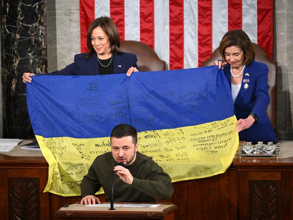 Ukrainian President Volodymyr Zelenskyy speaks to Congress after giving a Ukrainian flag to Vice President Harris and then-Speaker Nancy Pelosi on Dec. 21, 2022.