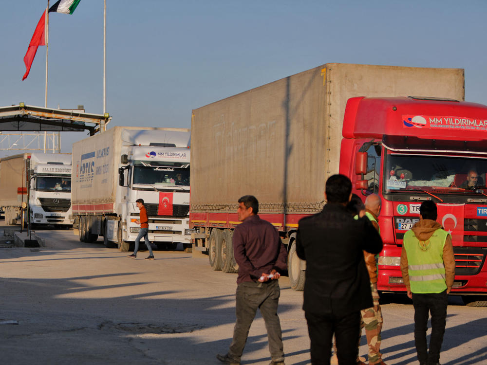 Trucks in an aid convoy cross from Turkey into rebel-held northern Syria through the Bab al-Salama crossing on Feb. 14, after it reopened for U.N. relief.