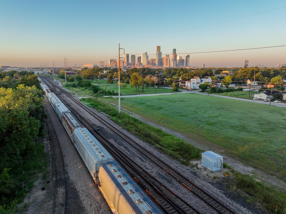 A freight train is seen traveling through Houston in 2022. The U.S. freight rail network runs on almost 140,000 route miles, according to the Federal Railroad Administration. And U.S. railroads typically transport more than 2 million carloads of hazardous materials each year, according to the Association of American Railroads.