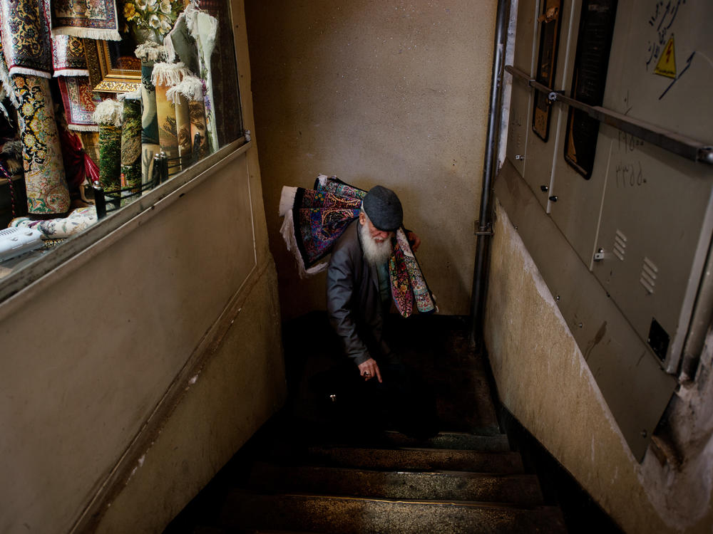 A carpet trader from Qom in the Tehran Grand Bazaar, Feb. 8, 2023.