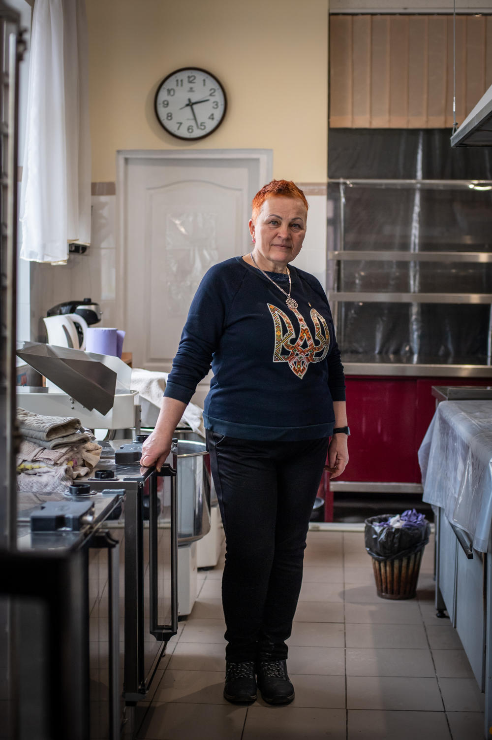Oksana Pohomii, a 59-year-old accountant and city council member who had spied on the Russian forces during their occupation of Kherson, poses for a portrait in the bakery where she now bakes and distributes bread to local residents.