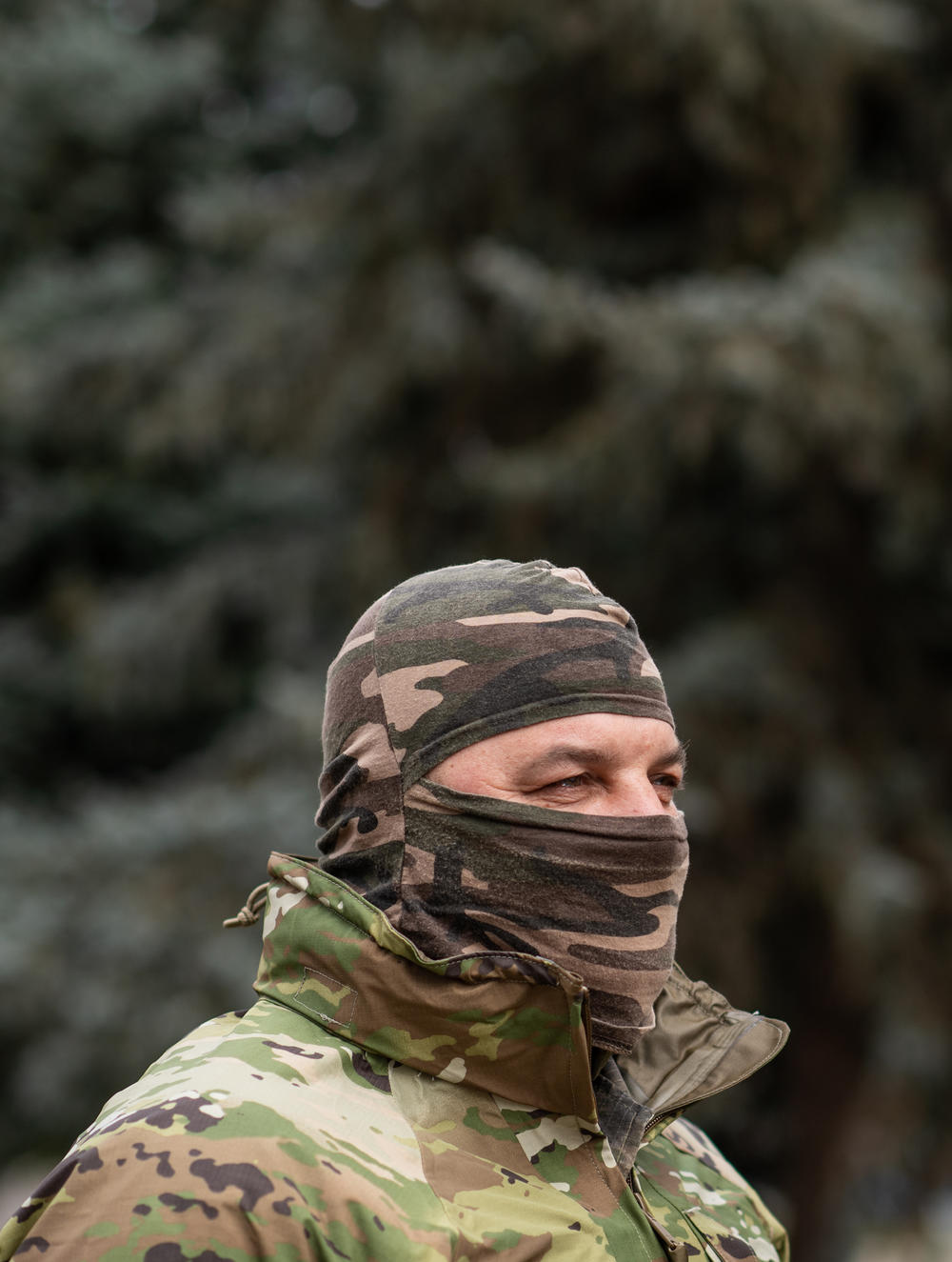 Serhiy, a soldier who cannot show his face or reveal his last name as he has family in occupied territory, poses in a park in Kherson, Ukraine. He had used information given by local civilians to target Russian forces during the occupation of Kherson.