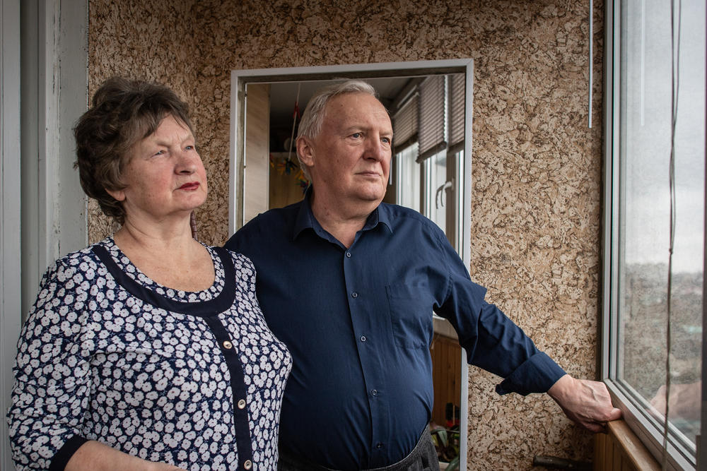 Tetiana Horobstova, 70, and her husband, Volodymyr, on the balcony of their home, where their daughter was talking on the phone when Russian soldiers came to arrest her in Kherson, Ukraine.