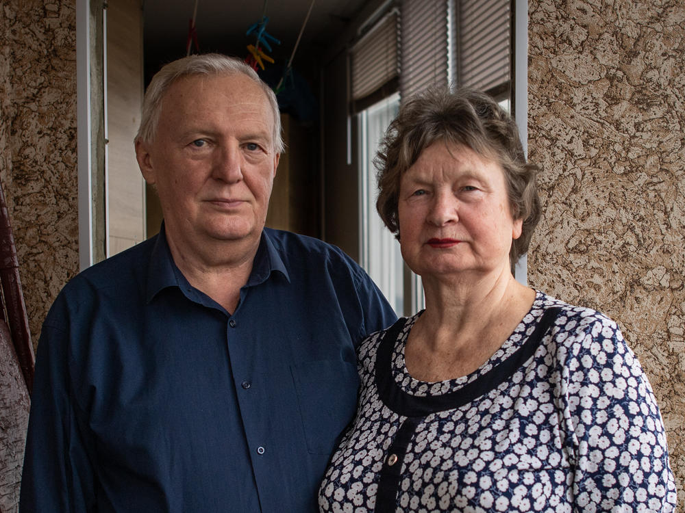 Tetiana Horobstova, 70, and her husband, Volodymyr, on the balcony of their home, where their daughter was talking on the phone when Russian soldiers came to arrest her in Kherson, Ukraine.