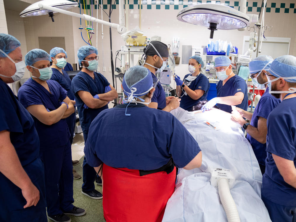 The medical team at UPMC Presbyterian hospital prepares Rendulic for the implantation of the spinal cord stimulation electrodes.