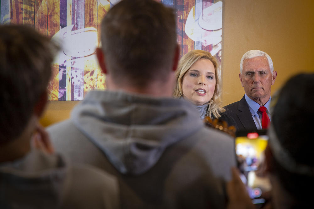 Iowa Republican Rep. Ashley Hinson introduces former Vice President Mike Pence to a crowd of Iowans in an event room at a Pizza Ranch in Cedar Rapids, Iowa on Feb. 15, 2023.