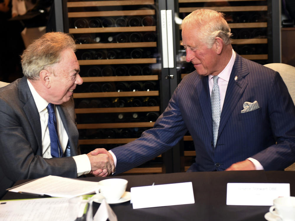 FILE - Britain's Prince Charles meets Andrew Lloyd Webber during a visit to the Royal Albert Hall to discuss the arts and creativity in school, in London, Wednesday, Sept. 5, 2018. Andrew Lloyd Webber, the English composer who created the scores for blockbuster musicals such as 