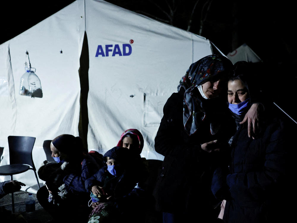 People in Antakya, Turkey, react after a new earthquake struck on Monday.