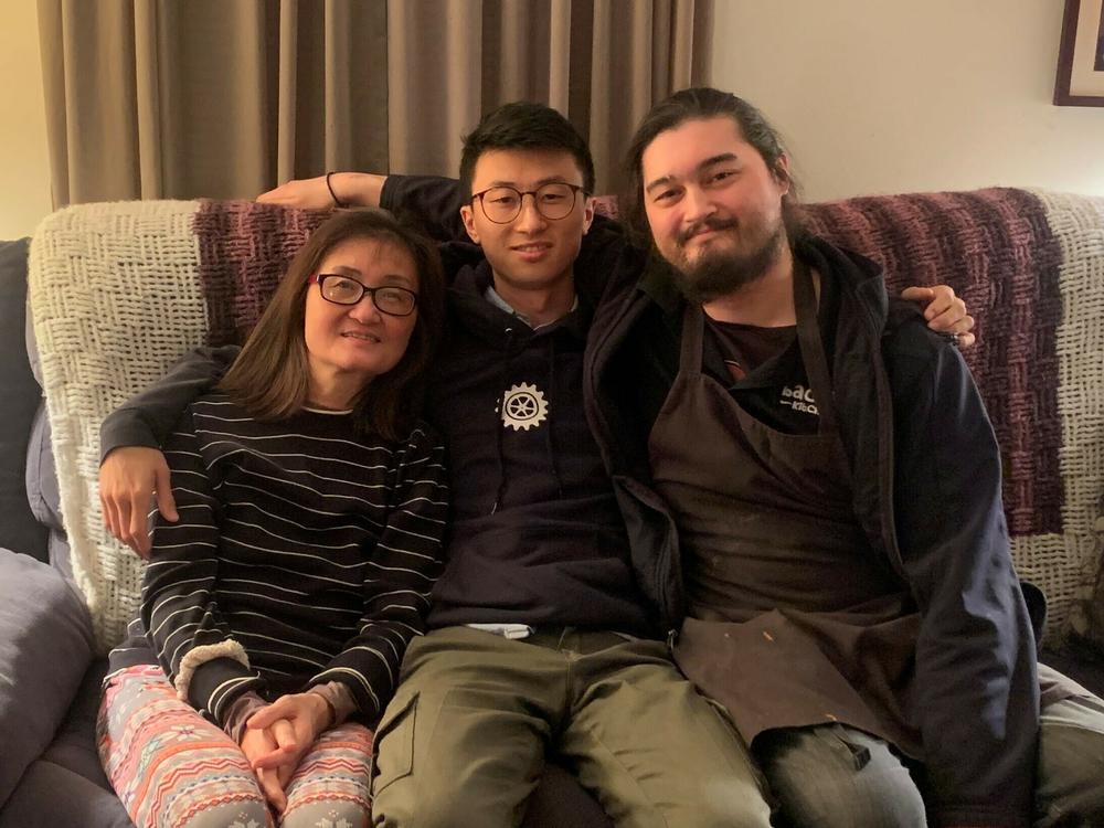 Director Bing Liu (center) with his mother and half-brother.