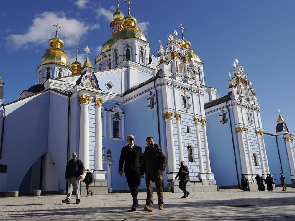 President Biden and Ukrainian President Volodymyr Zelenskyy walk in front of St. Michael's cathedral in Kyiv ahead of the anniversary of Russia's invasion of Ukraine.