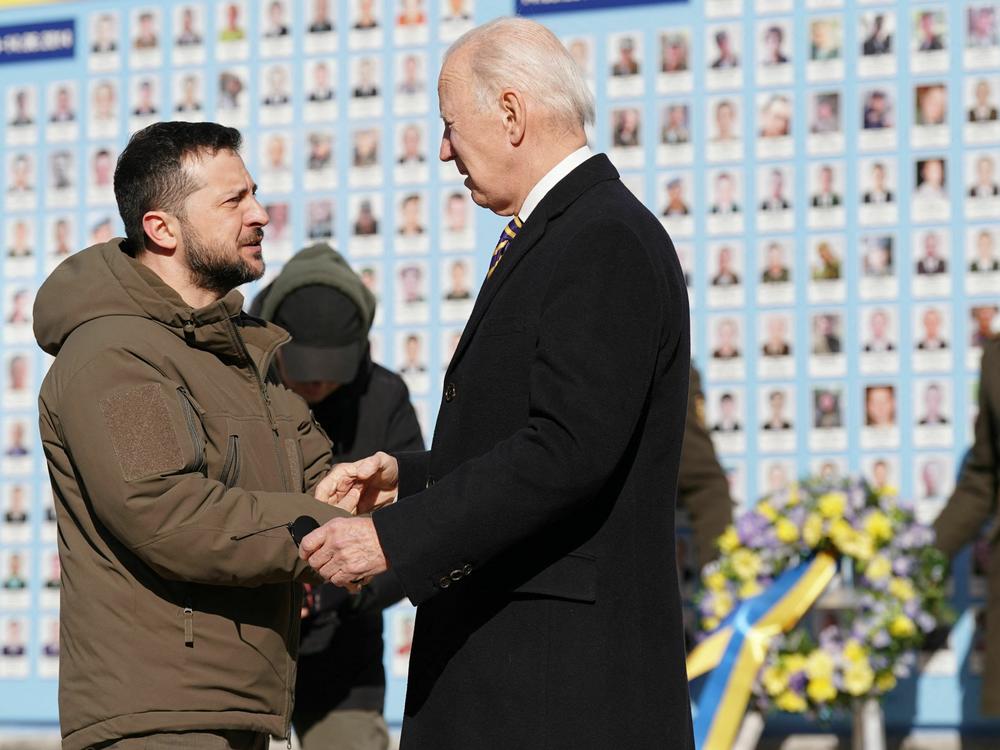 President Biden and Ukrainian President Volodymyr Zelenskyy speak together outside St. Michael's cathedral in central Kyiv.