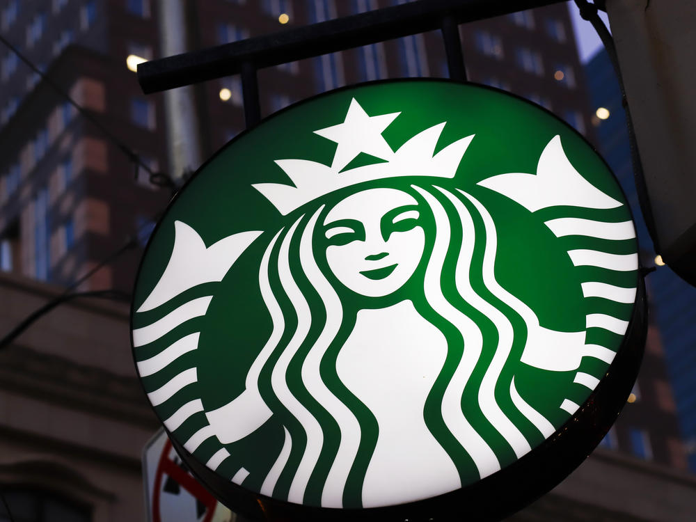 This June 26, 2019, photo shows a Starbucks sign outside a Starbucks coffee shop in downtown Pittsburgh.