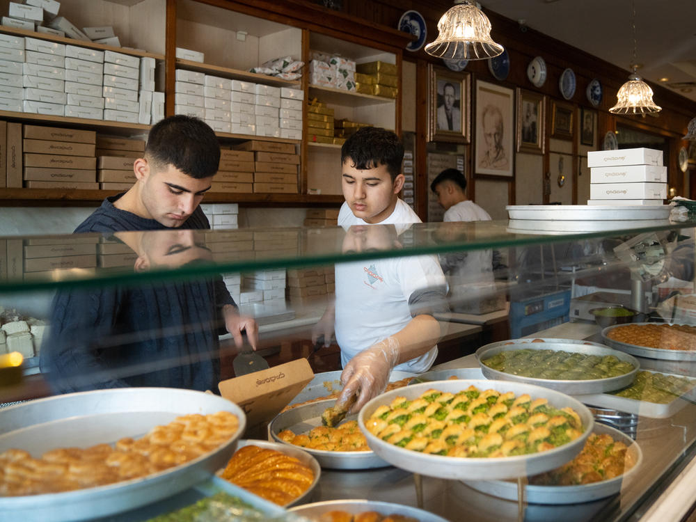 Employees box up baklava for customers at Imam Cagdas in Gaziantep, Turkey.
