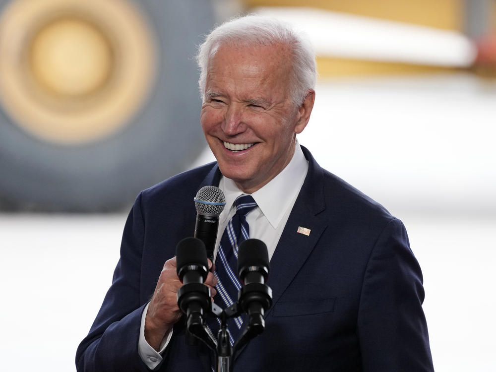 President Biden smiles as he speaks after touring the Taiwan Semiconductor Manufacturing Co. facility under construction in Phoenix on Dec. 6, 2022.