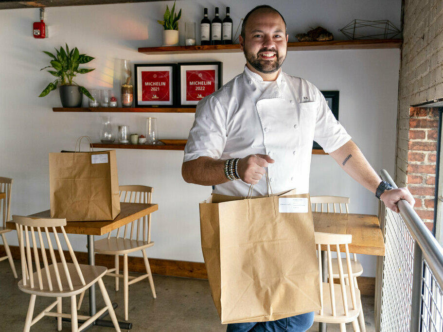 Matt Baker, chef and owner of Gravitas, poses for a portrait Feb. 14 inside the restaurant in Washington. Gravitas has a subscription service offering a monthly meal for two.