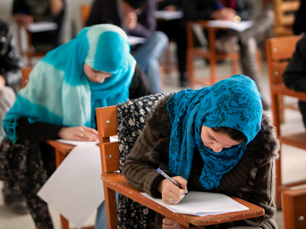 In December, the Taliban banned female students from attending university. Some of them are turning to online options. Above: Afghan female students attend Kabul University in 2010.
