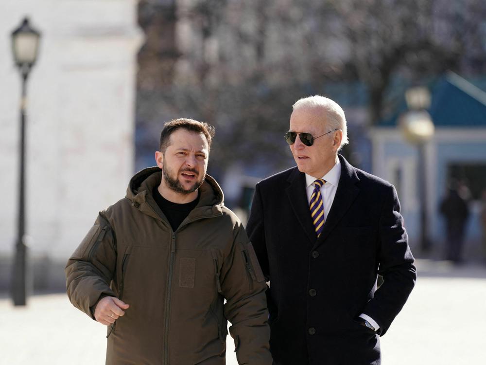 U.S. President Joe Biden walks next to Ukrainian President Volodymyr Zelensky on his surprise visit in Kyiv on Feb. 20.