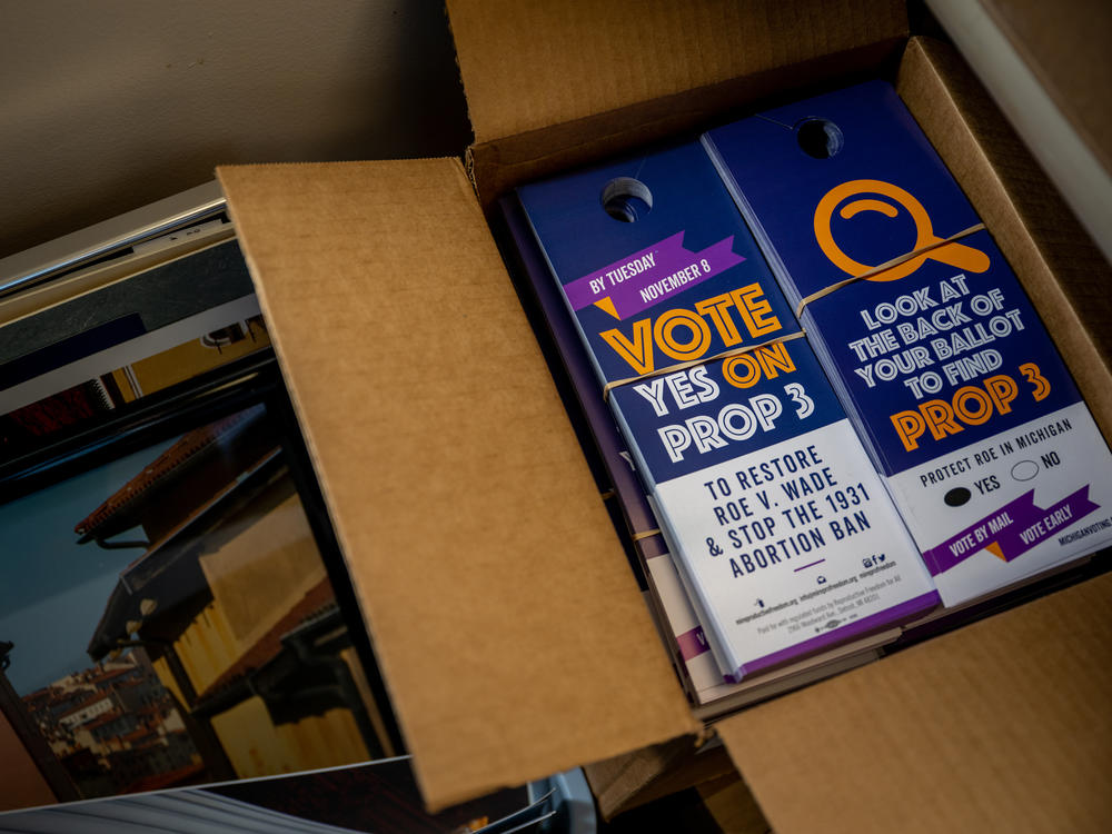 Proposal 3 flyers are situated in boxes on Nov. 6, 2022, in Dearborn, Mich. Voters in Michigan passed Prop 3, enshrining the right to abortion in the state constitution.