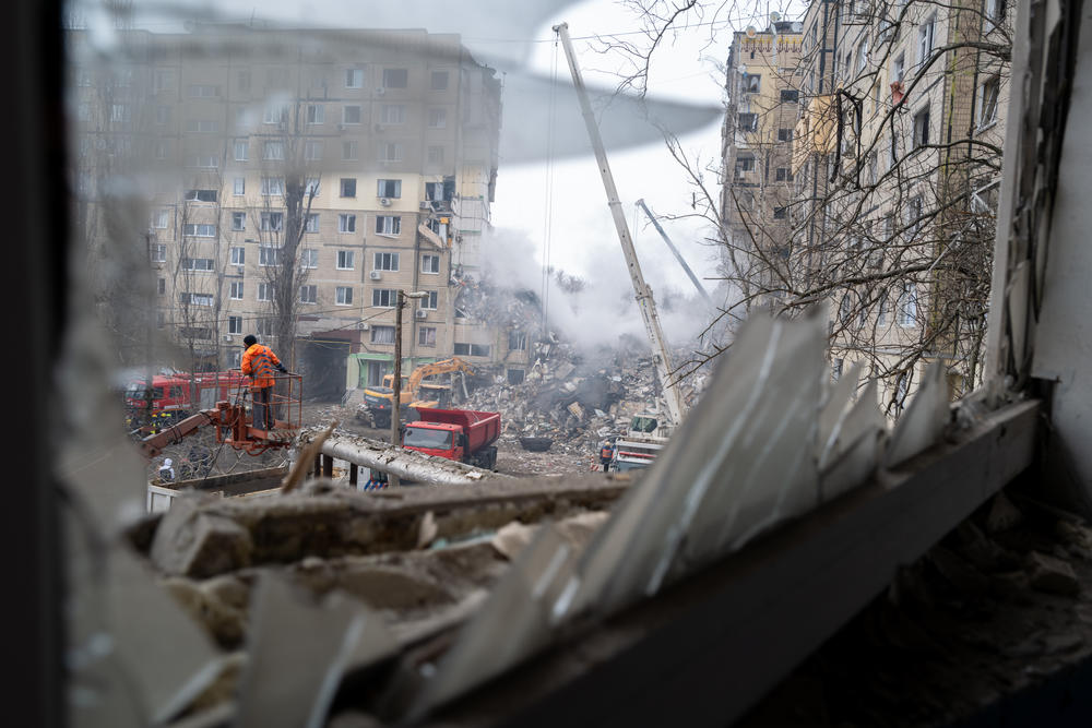 Emergency workers search the remains of a residential building that was struck by a Russian missile yesterday on Jan. 15, 2023 in Dnipro, Ukraine.