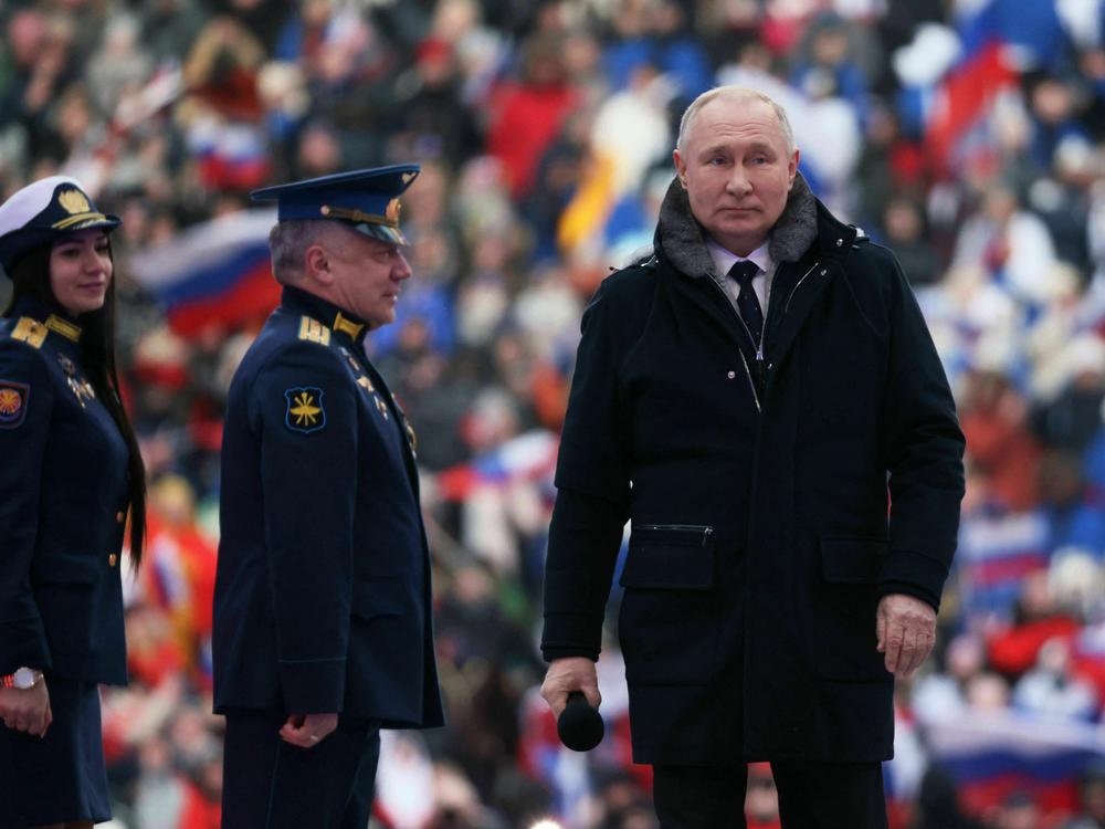 Russian President Vladimir Putin attends a patriotic concert at Luzhniki Stadium in Moscow on Wednesday.