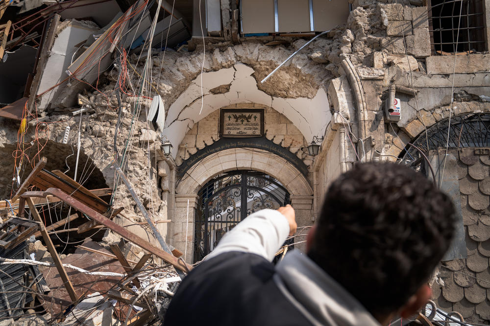 Yusuf Kocaoglu points to the Orthodox Church in Antakya that was destroyed during the earthquake.