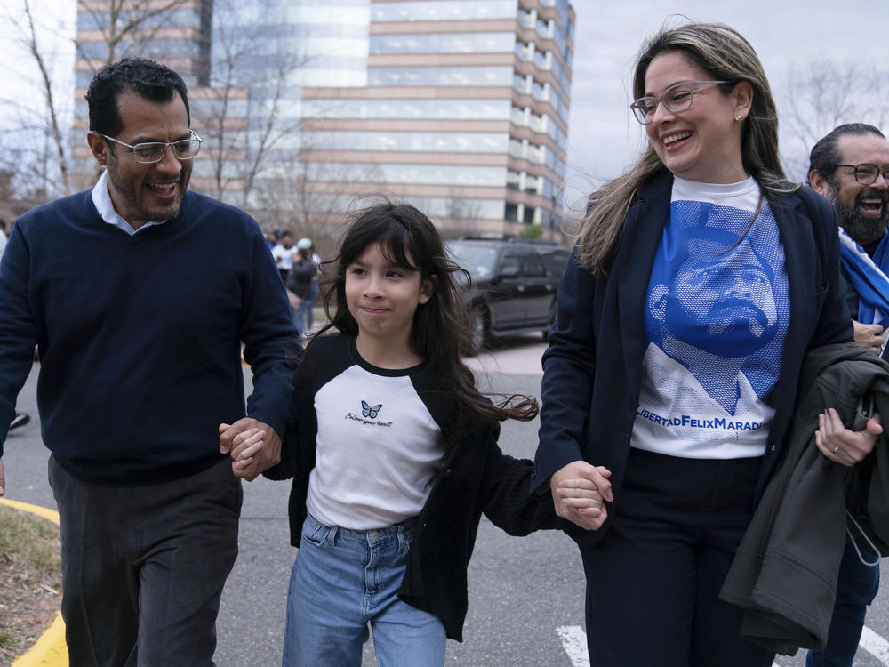 Former Nicaragua presidential candidate Felix Maradiaga reunits with his wife Berta Valle and his daughter Alejandra, walk together after Maradiaga arrived from Nicaragua at Washington Dulles International Airport, in Chantilly, Va., on Feb. 9.