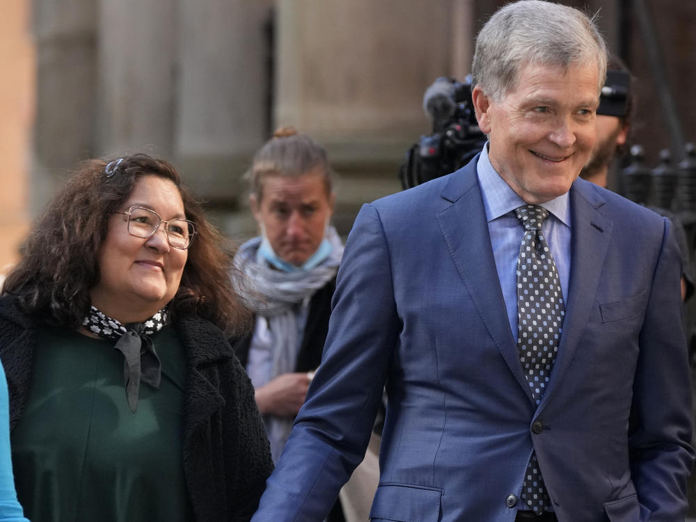 Steve Johnson, right, and his wife Rosemarie arrive at the Supreme Court in Sydney, Australia, on May 2, 2022, for a sentencing hearing in the murder of Scott Johnson, Steve's brother.