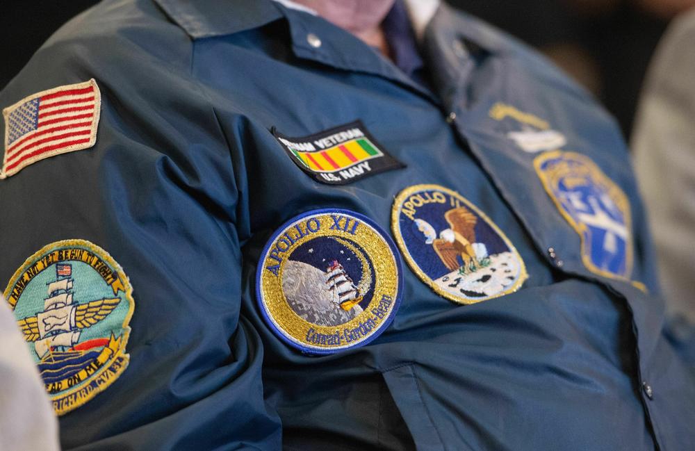 Larry Silva wears Apollo mission patches during an event reuniting the Apollo teams aboard the USS Hornet in Alameda, Calif. in 2019.