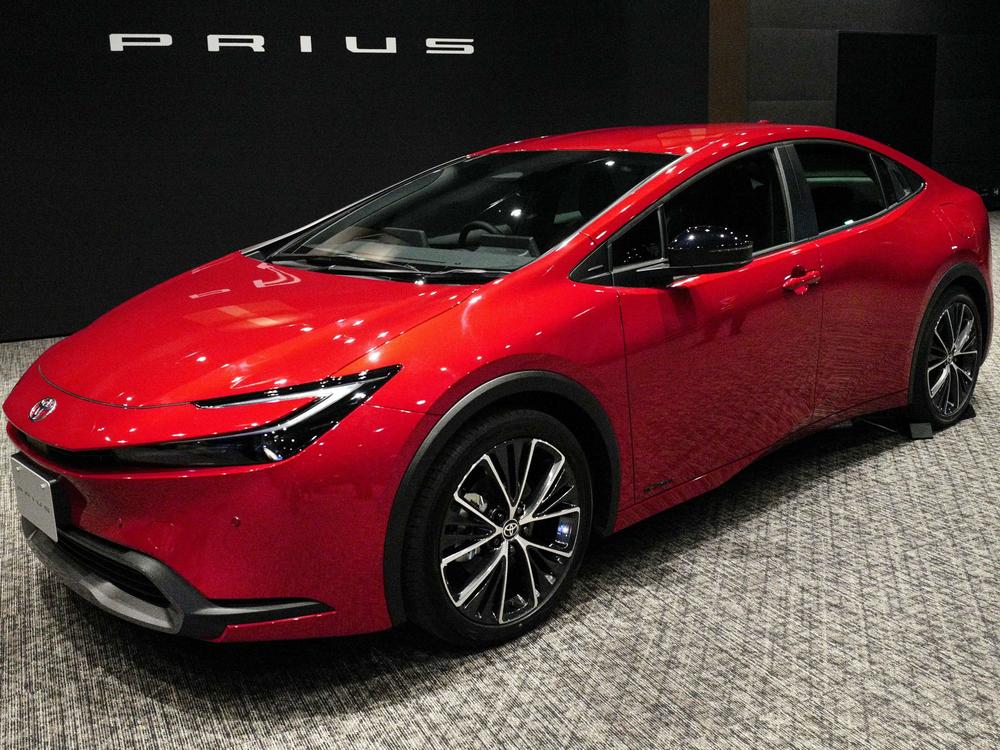 Toyota unveils a new Prius in Tokyo on Nov. 16, 2022. A quarter century after Toyota introduced the Toyota Prius, hybrids remain popular with shoppers.