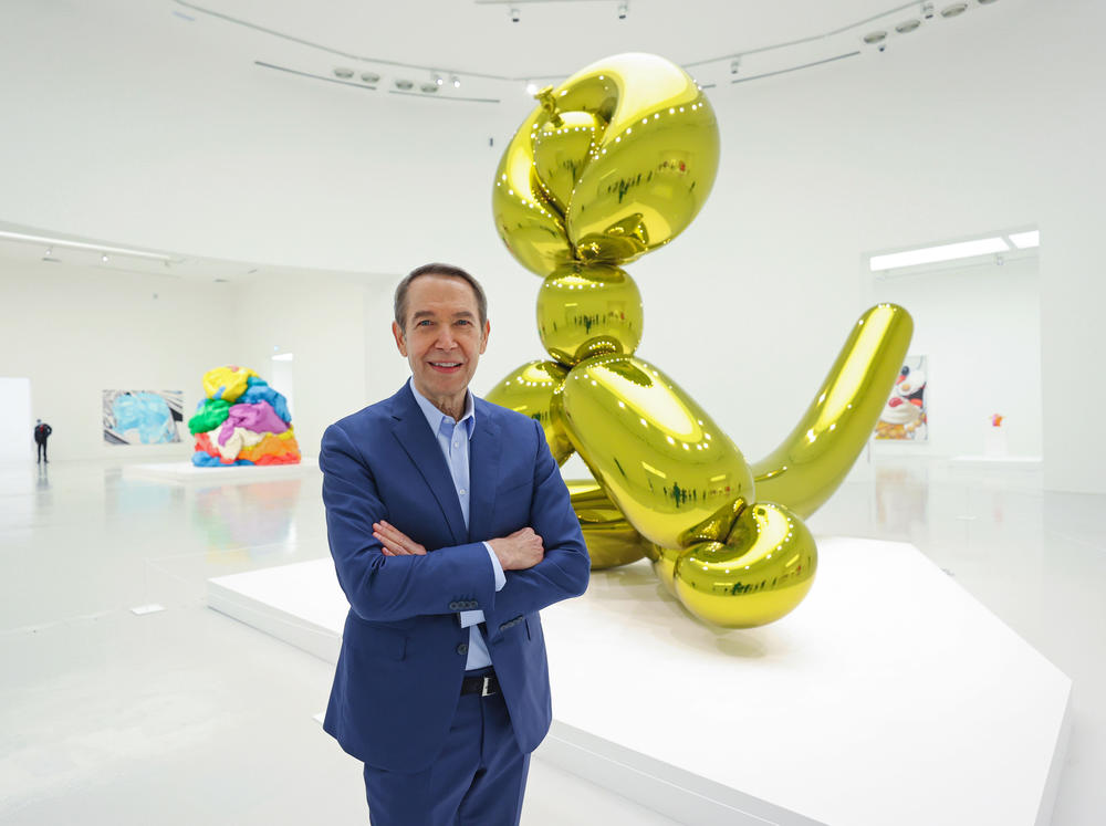 Jeff Koons poses during a press preview of his exhibition 