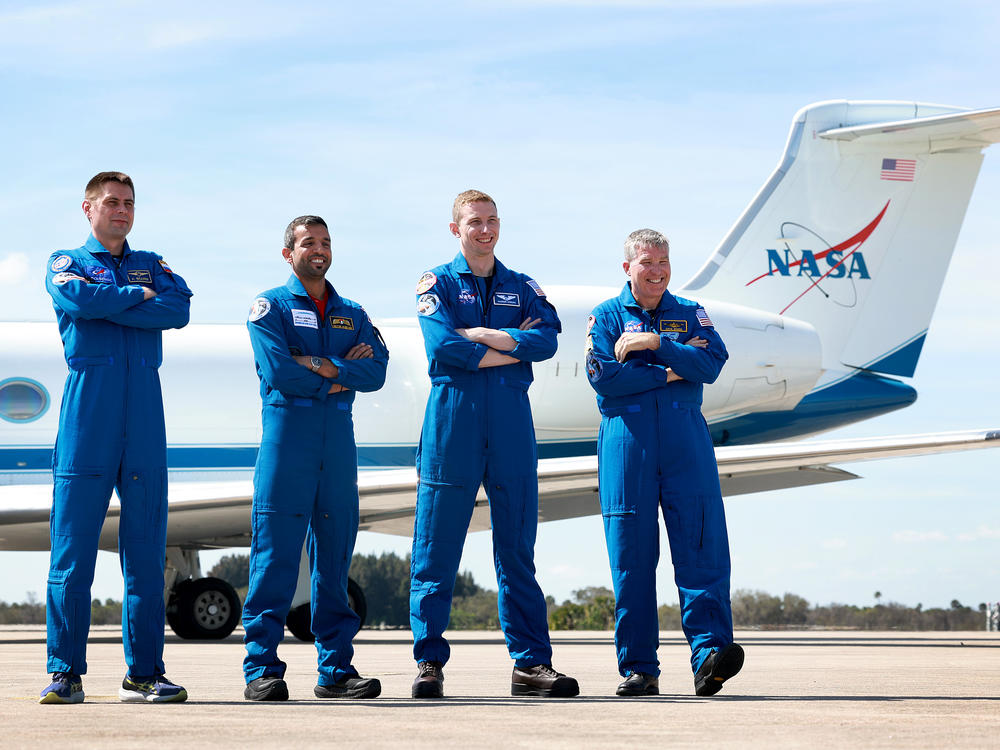 Members of Crew-6 — (L-R) Russian cosmonaut Andrey Fedyaev, Sultan Al-Neyadi of the United Arab Emirates, and NASA astronauts Warren Hoburg and Stephen Bowen — pose after arriving at Florida's Kennedy Space Center on February 21, 2023 in Florida. Each of their flight suits has numerous patches - including one designed specifically for this mission to the International Space Station.