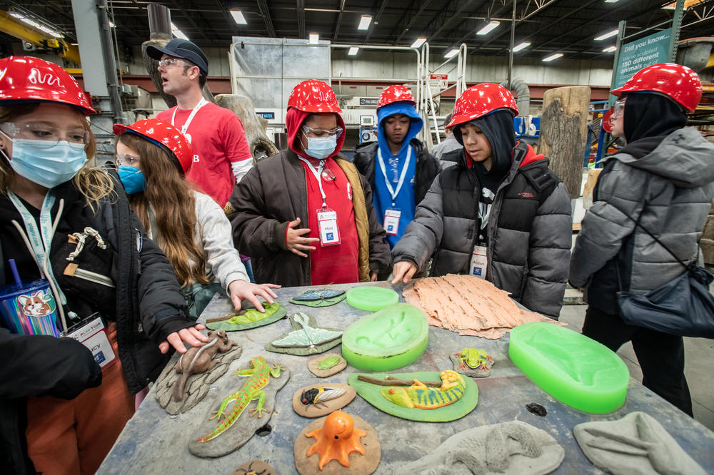 Fifth- and sixth-graders from Glen Lake Elementary look at sample playground designs.