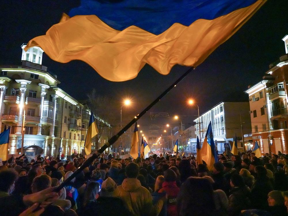 Residents of Mariupol, Ukraine, gather for a second night to show support for their city in the wake of Russia's latest political statements and military actions on Feb. 22, 2022 — two days before Russia's full-scale invasion would begin.