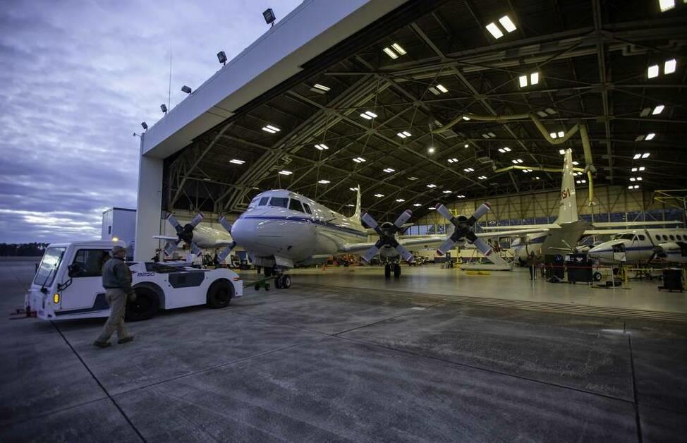 The P-3 research plane leaving its hangar at NASA's Wallops Flight Facility in Virginia.