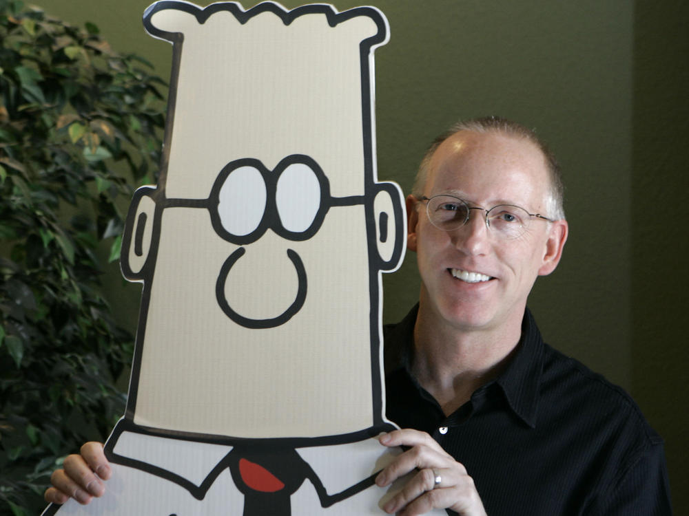 Scott Adams, creator of the comic strip <em>Dilbert</em>, poses for a portrait with the Dilbert character in his studio in Dublin, Calif., in 2006. Several prominent media publishers across the U.S. are dropping the comic strip after Adams described people who are Black as members of 