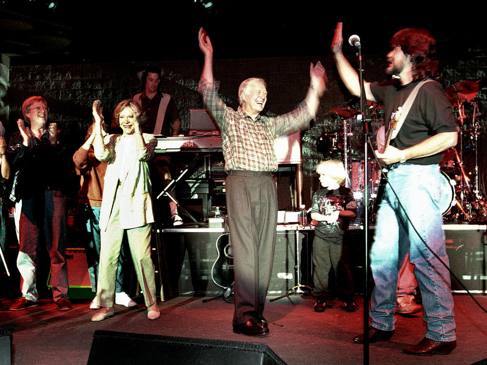 1984: Jack Carter, Elizabeth Carter, former first lady Rosalynn Carter and former President Jimmy Carter join Randy Owen, the lead singer of country group Alabama, on stage at the Peachtree City Amphitheater outside Atlanta, Ga.